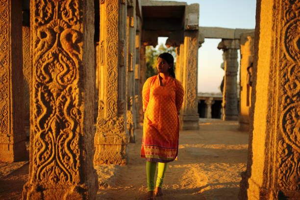 istock Young Lady Walks in the Lepakshi Temple 802620578