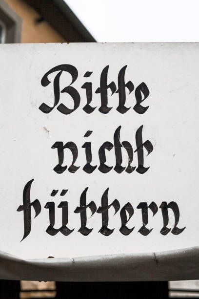Sign board written in german, asking not to feed animals