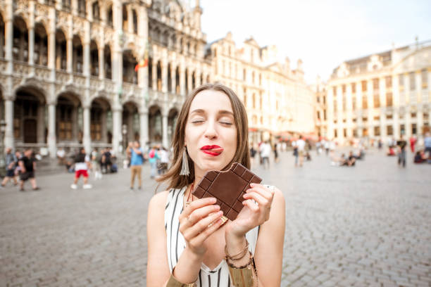 istock Woman with chocolate outdoors in Brussels 802623756