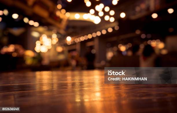 Wood Table On Blur Cafe With Light Background Stock Photo - Download Image Now