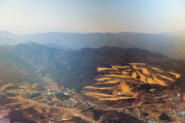 istock Abstract background of the mountain looking from the airplane - Drone (Aerial view), Sorted as layer and look amazing image, including damp, building, road and town 802636558