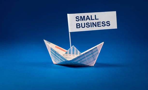 istock Small word with Boat paper graph on blue ocean. 802641286