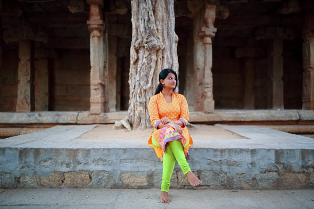 istock Female Sitting in the Temple Premises 802641334