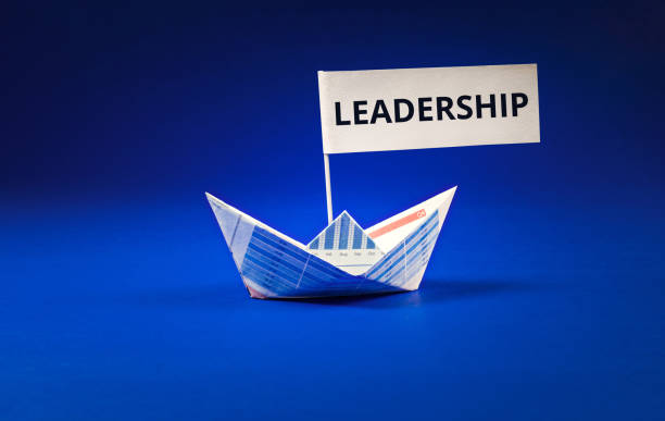 istock Leadership word with boat paper graph on blue ocean.business concept. 802641404