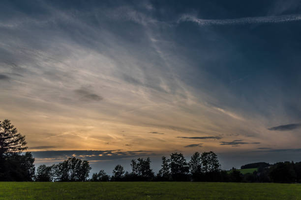 Summer evening near Roprachtice village with green meadow