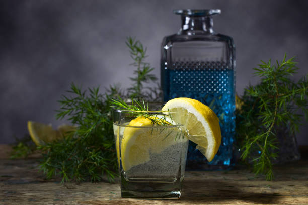 Cocktail with blue gin , tonic and lemon .