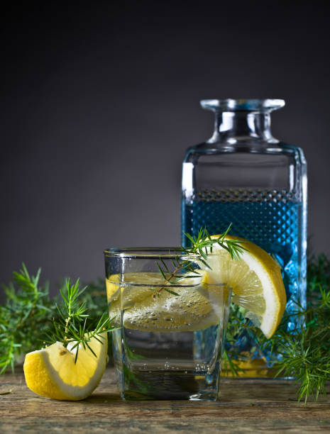Cocktail with blue gin , tonic and lemon .