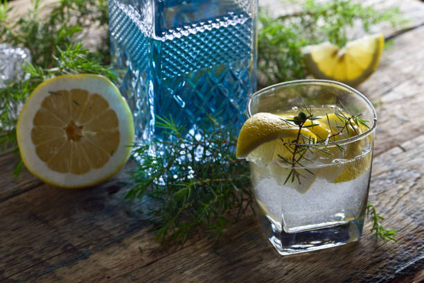 Cocktail with blue gin , tonic and lemon .