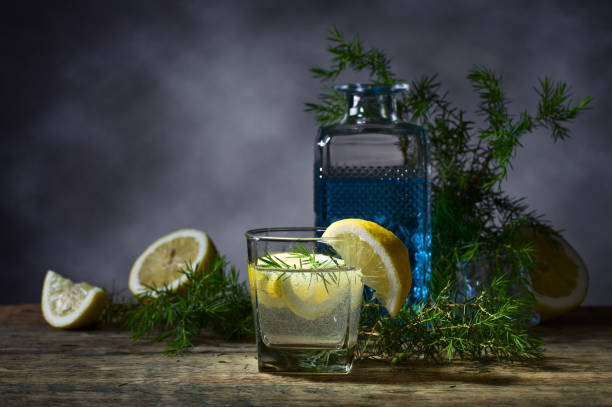 Cocktail with blue gin , tonic and lemon .