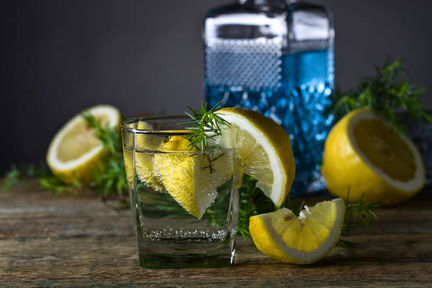 Cocktail with blue gin , tonic and lemon .