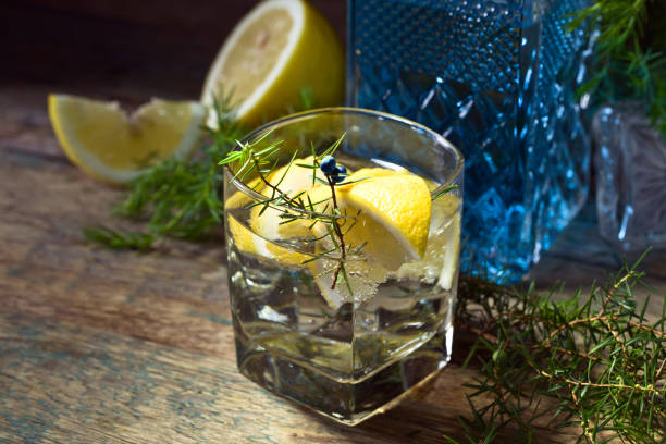 Cocktail with blue gin , tonic and lemon .