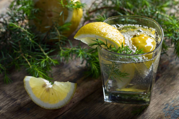 Cocktail with blue gin , tonic and lemon .