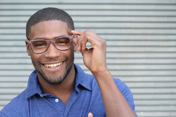 istock African holding his eyeglasses and smiling 802648974