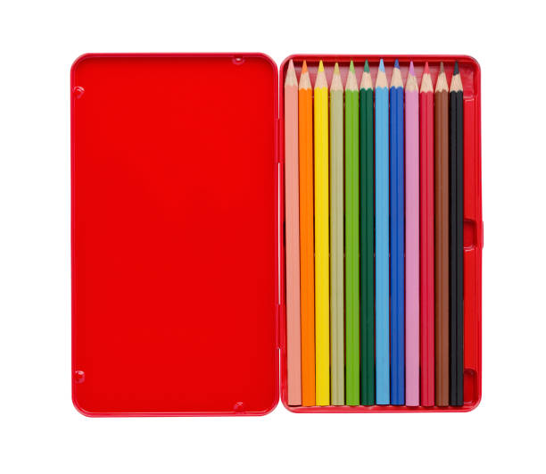 twelve colored pencils in a red case with copy space isolated on white