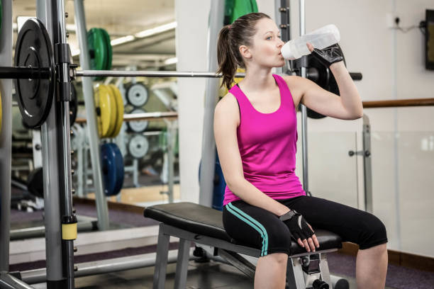 istock Fit woman drinking water 802649500