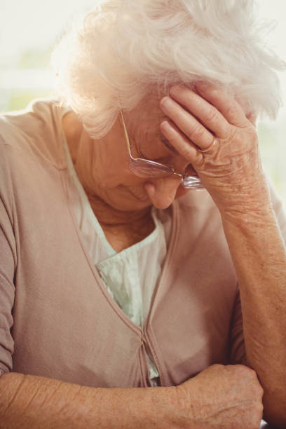 istock Elderly woman with headache 802649756