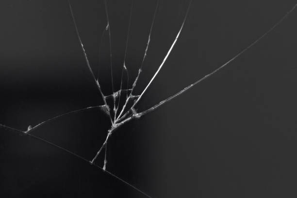 Crack on the glass of a smartphone or tablet, result of a fall or damage. stock photo