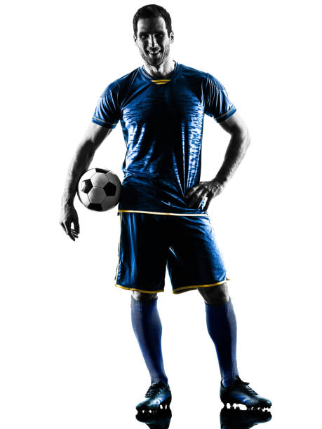istock soccer player man standing smiling silhouette isolated 802662356
