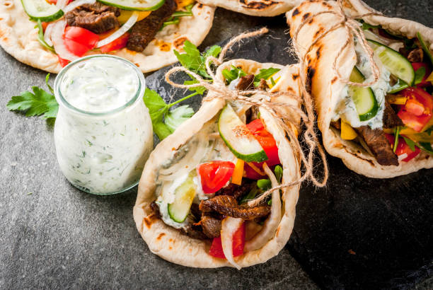 greek wrapped sandwich gyros - opa! souvlaki of greece imagens e fotografias de stock