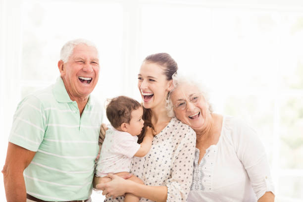 nonni felici che giocano con il nipote - baby grandparent grandmother grandfather foto e immagini stock