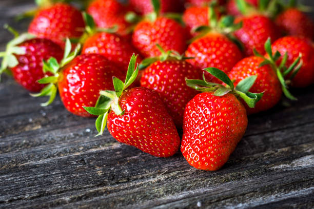 istock Fresh strawberry on wooden background 802674684