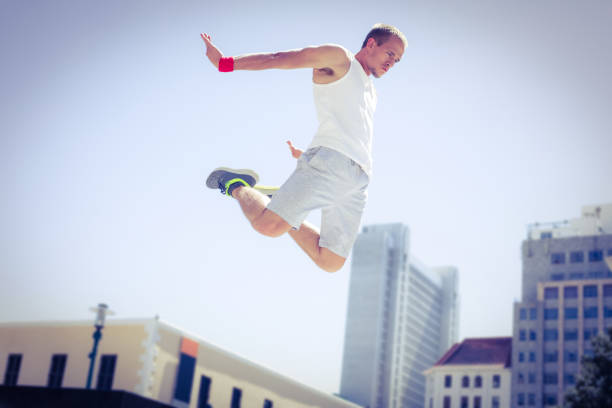 istock Man doing parkour in the city 802674806