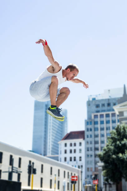 istock Man doing parkour in the city 802674840
