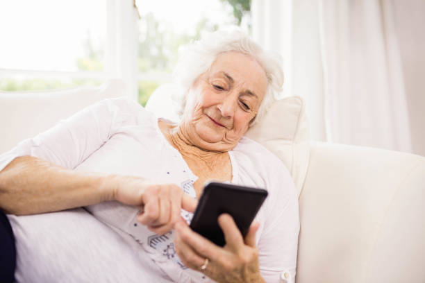 istock Elderly woman using her smartphone 802674842