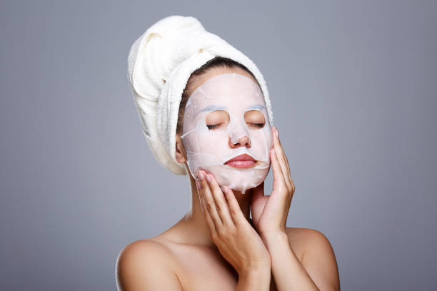 istock Girl with white mask on face 802679446