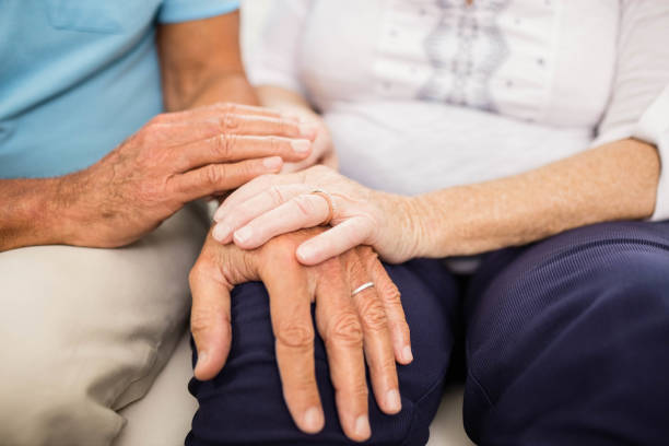 istock Cute senior couple holding hands 802701464