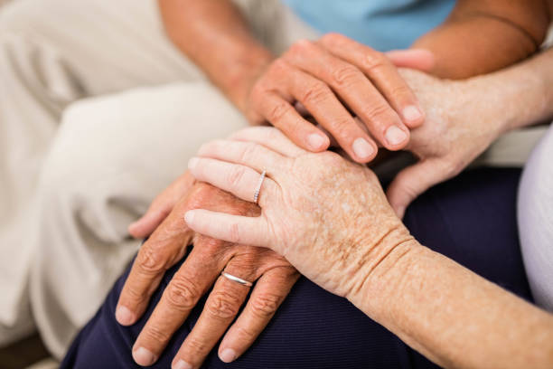 istock Cute senior couple holding hands 802701474