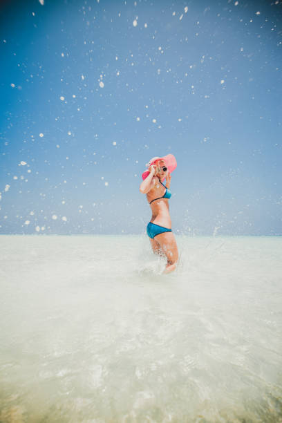 istock Woman jumping on the beach, Maldives 802721848