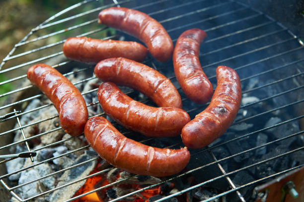 istock Sausages on a barbecue grill. Fried sausages 802735476