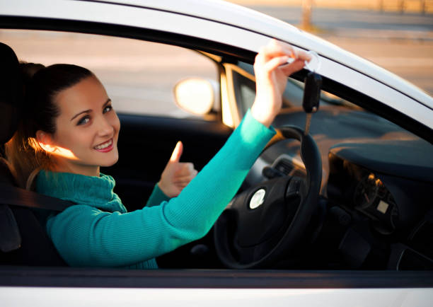 istock Happy woman in her car 802752422