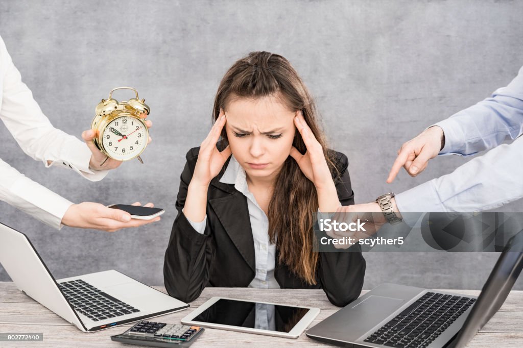 Female office worker is tired of work and exhausted. Female office worker is tired of work and exhausted. She has burned down and has depression. Emotional Stress Stock Photo