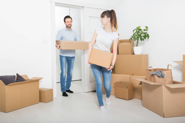 istock Young people move into a new apartment. 802772786