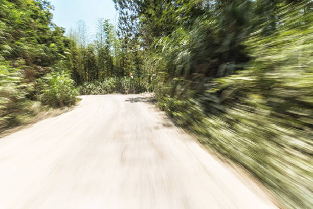 istock concrete rural road in the sunny day 802775054