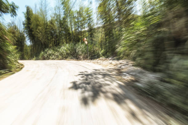 istock concrete rural road in the sunny day 802775194