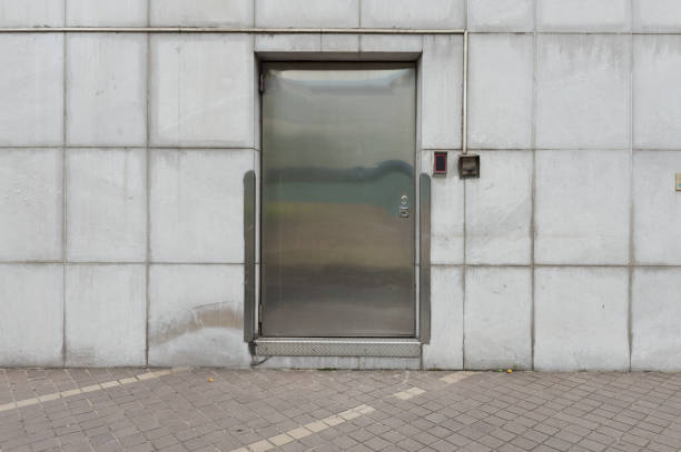 istock sidewalk by street wall & door 802793516
