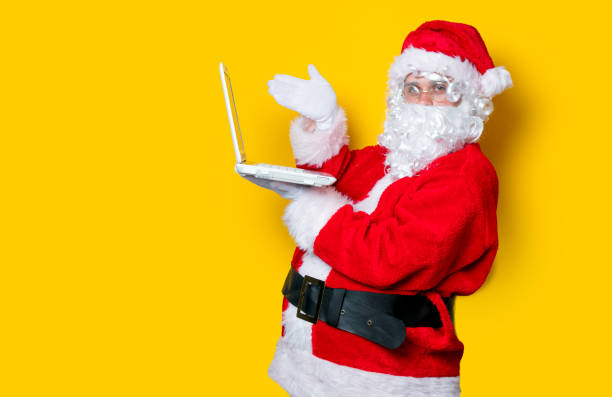 istock Funny Santa Claus have a fun with laptop 802799542
