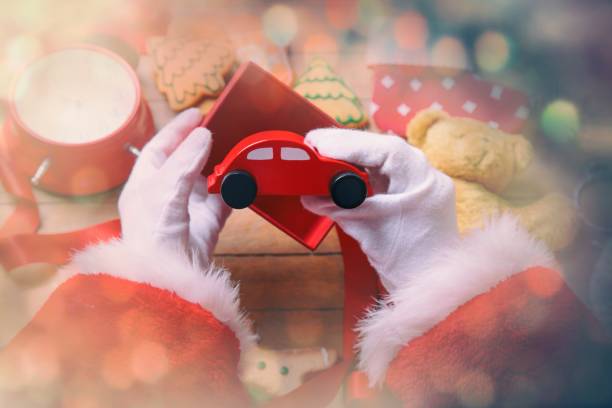 istock Santa Claus have wrapping a Christmas toy car 802801620