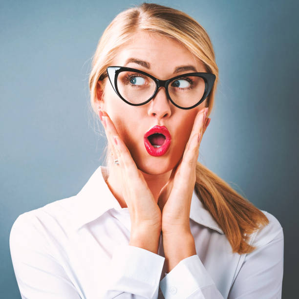 istock Surprised young woman posing 802801960