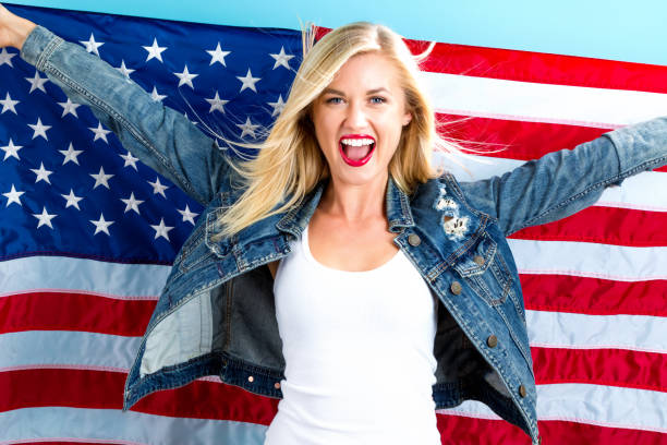 istock Young woman holding American flag 802801964