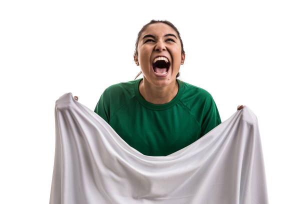 istock Soccer woman celebrating on green uniform 802809688