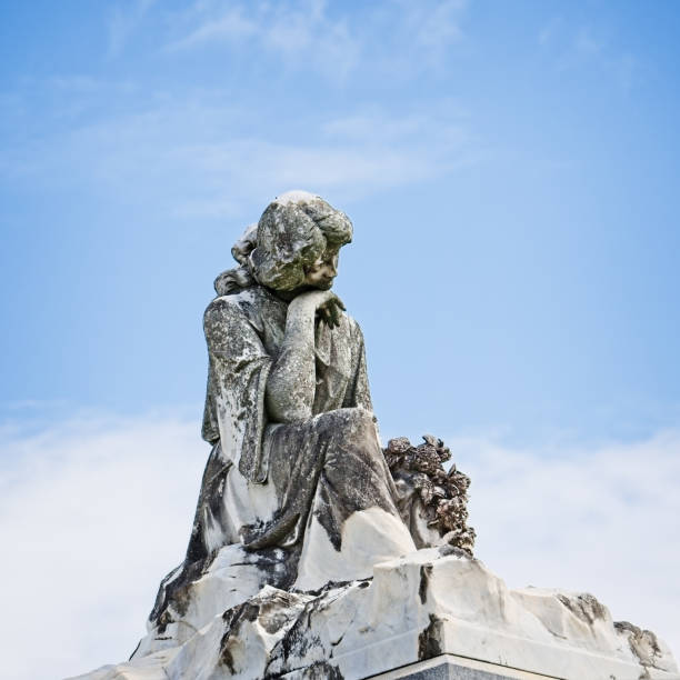istock Statue of Women on Tomb 802809796