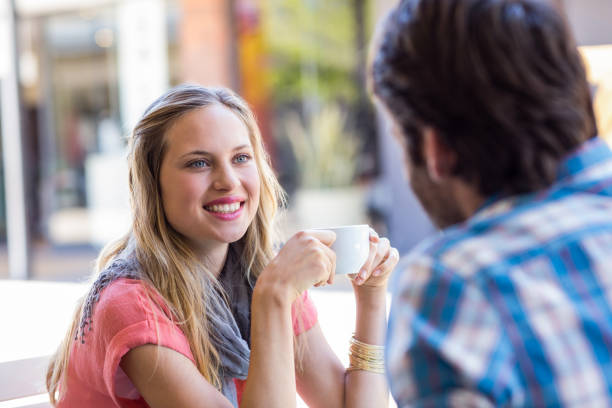 istock Cute couple having coffee together 802830484