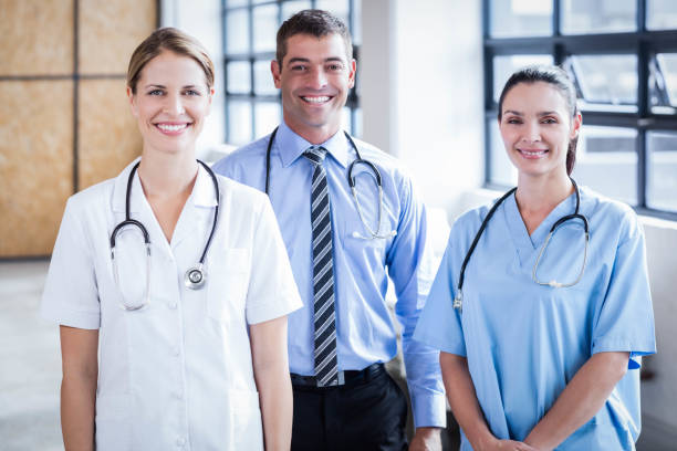istock Medical team smiling at camera together 802833298