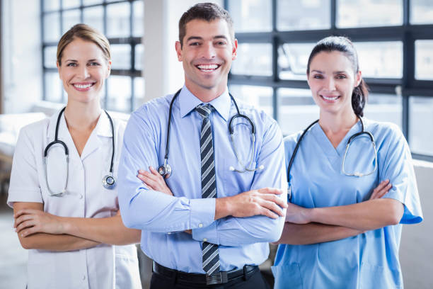istock Medical team smiling at camera together 802833308
