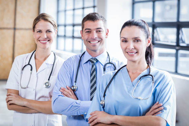 istock Medical team smiling at camera together 802833318