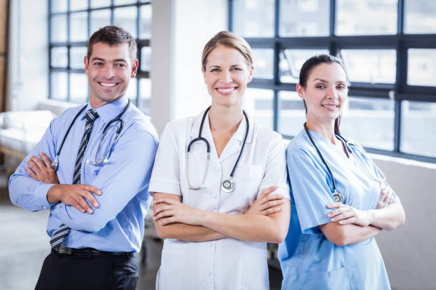 istock Medical team smiling at camera together 802833324